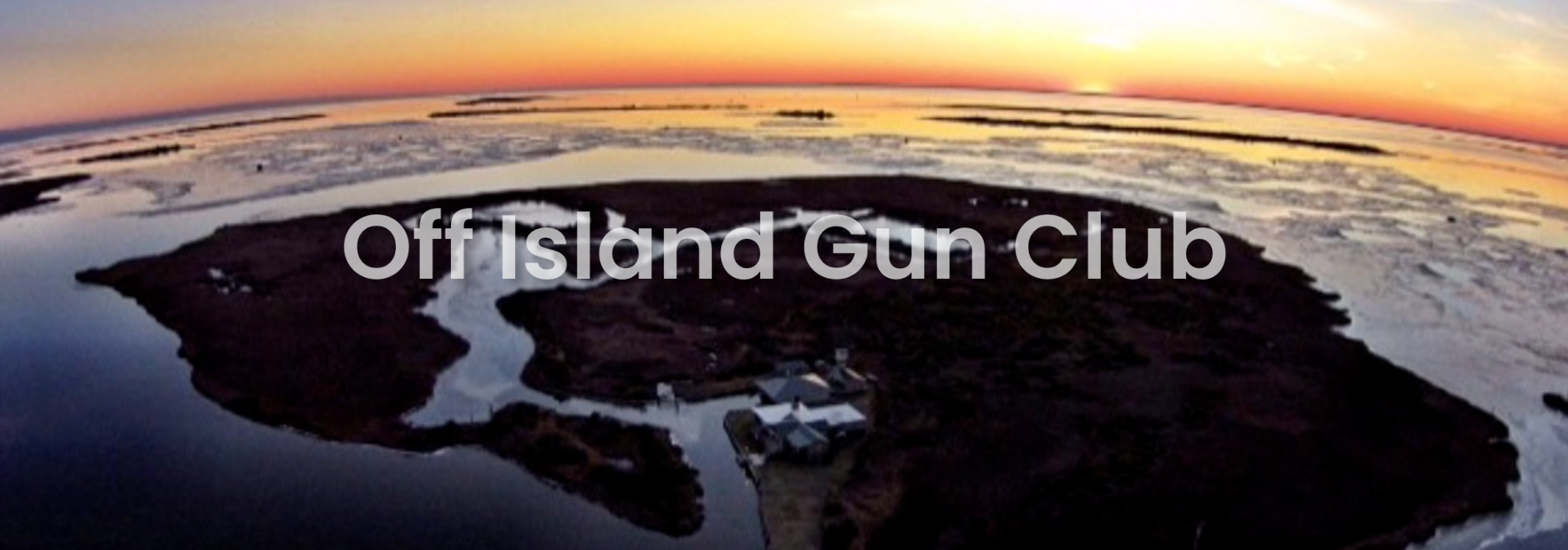 Sunset aerial view of the island, with Off Island Gun Club lettering